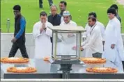  ?? RAJ K RAJ/HT PHOTO ?? Congress president Rahul Gandhi and party’s Delhi unit leaders pay tribute to Mahatma Gandhi at Rajghat in New Delhi on Monday, shortly before the daylong fast observed by its workers all over the country to promote communal harmony.