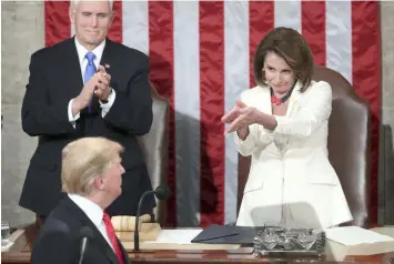  ?? (AP Photo/Andrew Harnik) ?? President Donald Trump turns to House speaker Nancy Pelosi of Calif., as he delivers his State of the Union address to a joint session of Congress on Capitol Hill in Washington, as Vice President Mike Pence watches, Tuesday, Feb. 5, 2019.