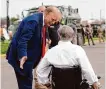  ?? Eric Gay/associated Press ?? Former President Donald Trump talks with Gov. Greg Abbott on Thursday at Shelby Park in Eagle Pass.