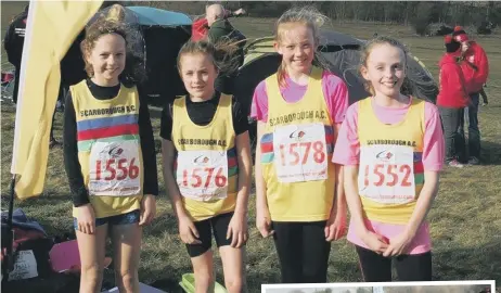  ??  ?? The Under-13s girls team ahead of the Cross Country League race (above), while Issy Nicholls (right) led from start to finish in Richmond