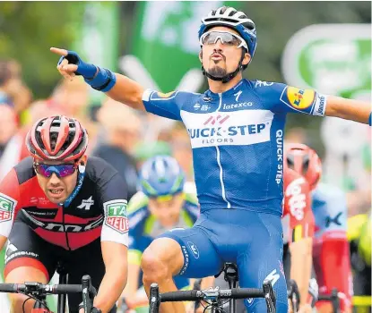  ?? Photo / Getty Images ?? Patrick Bevin (left) was edged for the stage three win by Julian Alaphilipp­e but second place was good enough to hand the Kiwi the green jersey.