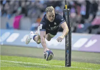  ?? PICTURE: STU FORSTER/GETTY IMAGES ?? Duhan van der Merwe scores a try for Scotland against England at Murrayfiel­d