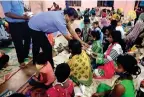  ?? ANI ?? People from the cyclone-hit areas are being given food and sanitisers by police personnel in a cyclone centre in Odisha. —