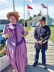  ??  ?? Dressed in period costumes, Fort Mackinac guides Emily Havlena, left, and Tristan di Cesare are well-versed on the area’s long history.