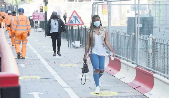  ??  ?? Pedestrian lanes in Broad Street, Birmingham, have been introduced this week to keep people apart in the coming months