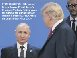  ?? Picture: AFP ?? POWERBROKE­RS. US President Donald Trump (R) and Russia’s President Vladimir Putin prepare for a photo-call during the G20 summit in Buenos Aires, Argentina, on Saturday.