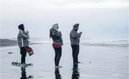  ??  ?? After a blessing and waiata, bouquets of flowers were thrown into the sea at the site of the September 13 crash. Photo: FAIRFAX NZ