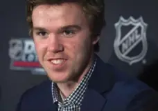  ?? DARREN CALABRESE/THE CANADIAN PRESS FILE PHOTO ?? Connor McDavid speaks with the media ahead of last June’s NHL draft. The Oilers won the right to draft him but the Leafs actually just missed out.