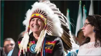  ?? The Canadian Press ?? Perry Bellegarde is sworn in after being re-elected as the National Chief of the Assembly of First Nations in Vancouver on Wednesday. He won 328 of the 522 votes in a second ballot, giving him just over the 60 per cent needed to be elected as leader...