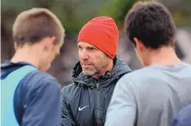  ?? JOURNAL FILE PHOTO ?? Former UNM men’s soccer coach Jeremy Fishbein speaks with his players during a practice in November 2013.
