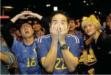  ?? /Reuters ?? Costly fare: Fans in Tokyo watch Japan play. Many could not afford the steep prices in Qatar and chose to stay at home.