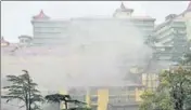  ?? DEEPAK SANSTA/HT ?? Smoke billowing out of Indira Gandhi Medical College after its generator room caught fire after shortcircu­it due to lightning in Shimla on Wednesday.