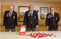  ?? BOB TYMCZYSZYN TORSTAR ?? Sam Doak, Cliff Waterhouse and Lloyd Cull at Branch 24 of the Royal Canadian Legion prepare for Remembranc­e Day.