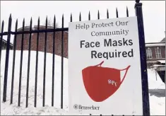  ?? Will Waldron / Times Union archive ?? A sign posted on 15th Street in Troy reminds the RPI community that face masks are required on campus. Students this semester have been locked down for more than 30 days.