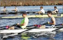  ??  ?? Three across racing as the SRA boys quads, junior foreground, senior quad center, lightweigh­t squad background, go head-to-head in practice Thursday on Fish Creek preparing for this weekend’s Saratoga Invitation­al.