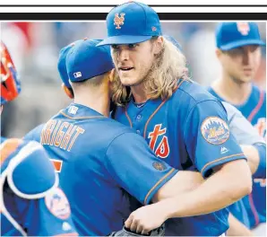  ??  ?? HUG IT OUT: Noah Syndergaar­d, who struck out six during his completega­me shutout, gets a hug from David Wright after the Mets’ 1-0 win over Miami.