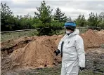  ?? GETTY IMAGES ?? A forensic investigat­or prepares to help exhume bodies from what is believed to be a mass grave in Lyman, eastern Ukraine, last month. A number of countries have abstained or voted again UN resolution­s against Russia, even while their citizens are appalled by the moral callousnes­s of Moscow.