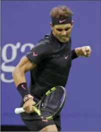  ?? JULIO CORTEZ — THE ASSOCIATED PRESS ?? Rafael Nadal reacts after scoring a point against Juan Martin del Potro Friday in New York.