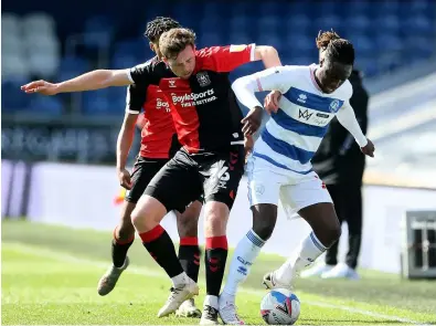  ??  ?? Sky Blues’ Jordan Shipley (left) tangles with QPR’S Osman Kakay at the Kiyan Prince Foundation Stadium