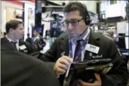  ?? RICHARD DREW / THE ASSOCIATED PRESS ?? Trader Michael Capolino works on the floor of the New York Stock Exchange Wednesday.