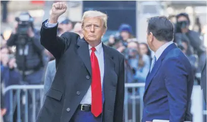  ?? Picture: EPA-EFE ?? CONFIDENT. Former US president Donald Trump pumps his fist as he departs 40 Wall Street after a press conference about his case in the criminal court in New York, New York on Monday.