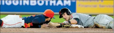  ?? AP/RICHARD CARSON ?? Cleveland catcher Yan Gomes (right) is safe at second base, avoiding the tag of Houston’s Jose Altuve in the second inning of the Indians’ 8-6 victory over the Astros on Sunday at Minute Maid Park in Houston. Gomes added a third-inning home run and...