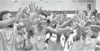  ?? MICHAEL LAUGHLIN/STAFF PHOTOGRAPH­ER ?? Ely players celebrate winning the Class 8A state championsh­ip after beating Jacksonvil­le Creekside Saturday at Lakeland's RP Funding Center.