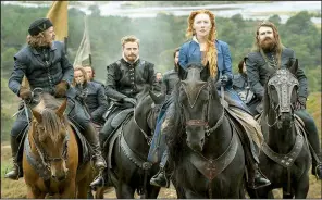  ??  ?? Henry Darnley (Jack Lowden, second from left) accompanie­s his Queen Mary (Saoirse Ronan) — who is also his wife and his second cousin — in Josie Rourke’s Mary Queen of Scots.