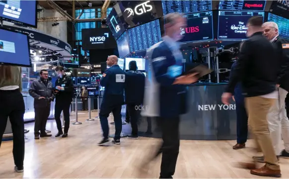  ?? AFP ?? The New York Stock Exchange. US technology stocks experience­d a stellar 2023, driving the benchmark S&P 500 index up by about 25 per cent