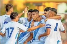  ?? Steven Eckhoff ?? Guatemalan players celebrate after scoring a goal in the first half of Wednesday’s game.