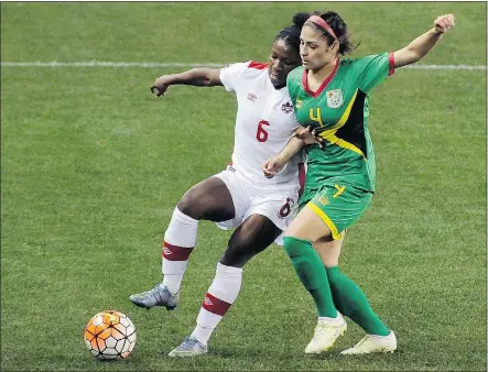  ?? — PHOTOS: THE ASSOCIATED PRESS ?? Canada’s Deanne Rose tries to hold off Guyana’s Kayla De Souza during the first half of a CONCACAF Olympic qualifying tournament match in Houston.