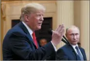  ?? PABLO MARTINEZ MONSIVAIS — THE ASSOCIATED PRESS ?? U.S. President Donald Trump speaks with Russian President Vladimir Putin during a press conference after their meeting at the Presidenti­al Palace in Helsinki, Finland, Monday.