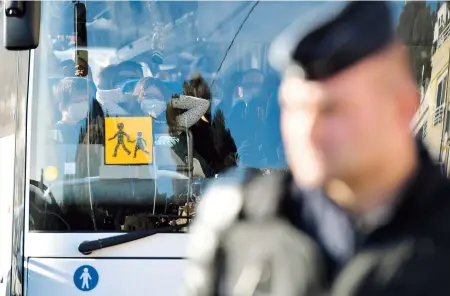  ??  ?? A vehicle carrying French citizens from Wuhan, capital of central China’s Hubei Province and the epicenter of the novel coronaviru­s outbreak, arrives at the Vacanciel Holiday
Resort in Carry-le-Rouet, near Marseille, southern France, yesterday. One of the passengers flown from Wuhan on board a flight with 179 others has been hospitaliz­ed with coronaviru­s symptoms, French Health Minister Agnes Buzyn said. The remaining evacuees were taken to the seaside holiday camp, where they will be kept in quarantine for two weeks. — AFP