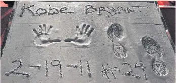 ??  ?? Bryant’s hand- and footprints in Hollywood.