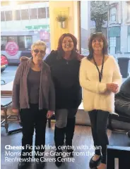  ??  ?? Cheers Fiona Milne, centre, with Joan Morris and Marie Granger from the Renfrewshi­re Carers Centre