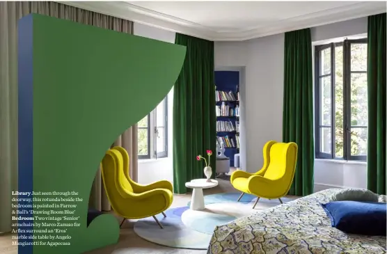  ??  ?? Library Just seen through the doorway, this rotunda beside the bedroom is painted in Farrow & Ball’s ‘Drawing Room Blue’ Bedroom Two vintage ‘Senior’ armchairs by Marco Zanuso for Arflex surround an ‘Eros’ marble side table by Angelo Mangiarott­i for Agapecasa