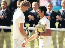  ?? / MATTHEW STOCKMAN / GETTY IMAGES ?? SA’s Kevin Anderson and Novak Djokovic with their trophies after the Serbian star claimed the Wimbledon singles final in London yesterday.