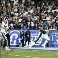  ?? KELVIN KUO — THE ASSOCIATED PRESS ?? Eagles defensive end Brandon Graham scores as Rams quarterbac­k Jared Goff chases last Sunday.