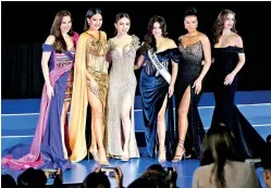  ?? ?? Jakapong Anne Jakrajutat­ip (third from left), CEO of Miss Universe's owner JKN Global Group, is pictured on stage during a pageant event in Bangkok, Thailand, in Nov 2022.