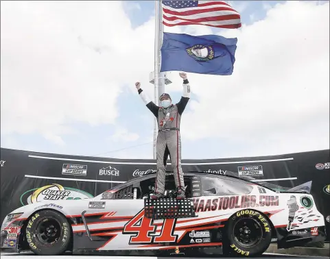  ?? Jared C. Tilton / Getty Images ?? Cole Custer celebrates in Victory Lane after winning the NASCAR Cup Series Quaker State 400 Kentucky Speedway on Sunday in Sparta, Ky.