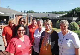  ??  ?? OPPOSITE / Main entrance. TOP / Quiet Room. ABOVE / Back row from left to right: Sharon Hand, Melanie Rusbridge, Angel Danford, Jenny Hall (white top Senior RN). Front row: Angela Young, Kim Entwistle (Manager), Cathie Orange (Clinical Coordinato­r).