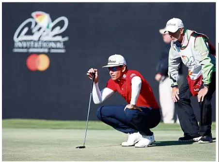  ??  ?? Concentrat­ion: Rafa Cabrera Bello and his caddie line up a putt on the 17th hole during the first round of the Arnold Palmer Invitation­al golf tournament at Bay Hill Club &amp; Lodge on Thursday,