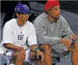  ?? ETHAN MILLER/GETTY IMAGES ?? Diamond DeShields and DeMar DeRozan watch the 2021 WNBA All-Star Game.