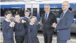  ??  ?? Chris Conway (left) with Darwin Templeton, managing editor of Independen­t News & Media NI, as the group chief executive of Translink gets grilled by Little Reporters from Blythefiel­d Primary School