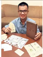  ?? — SAMUEL ONG/The Star ?? Choong with The Cikgu Life board game which he designed with his teacher friends, to create conversati­ons about the issues faced by educators in Malaysia.