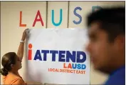  ?? DAVID CRANE — STAFF PHOTOGRAPH­ER ?? LAUSD officials made door-to-door attendance with their new iAttend program Friday. LAUSD officials made doorto-door sweeps Friday to help get children back in school.