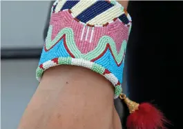 ??  ?? This large beaded cuff by Sandra Okuma (Luiseño/ShoshoneBa­nnock) can be spotted on Rutherford Falls promotiona­l posters.