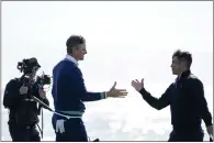  ?? GODOFREDO A. VÁSQUEZ — THE ASSOCIATED PRESS ?? Justin Rose, left, shakes hands with Kurt Kitayama, right, after winning the AT&T Pebble Beach Pro-Am in Pebble Beach on Monday.