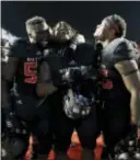  ?? THE ASSOCIATED PRESS ?? Rutgers players celebrate after defeating Maryland 31-24 on Saturday to improve to 4-5 overall and 3-3 in the Big Ten.