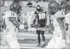  ?? Special to the Arkansas Democrat Gazette/ROB HERBERT ?? Arkansas State Red Wolves wide receiver Chris Murray celebrates with teammate Kendall Sanders (4) in the end zone after one of Sanders’ three touchdowns against Central Florida in the Cure Bowl on Dec. 17 at Camping World Stadium in Orlando, Fla....